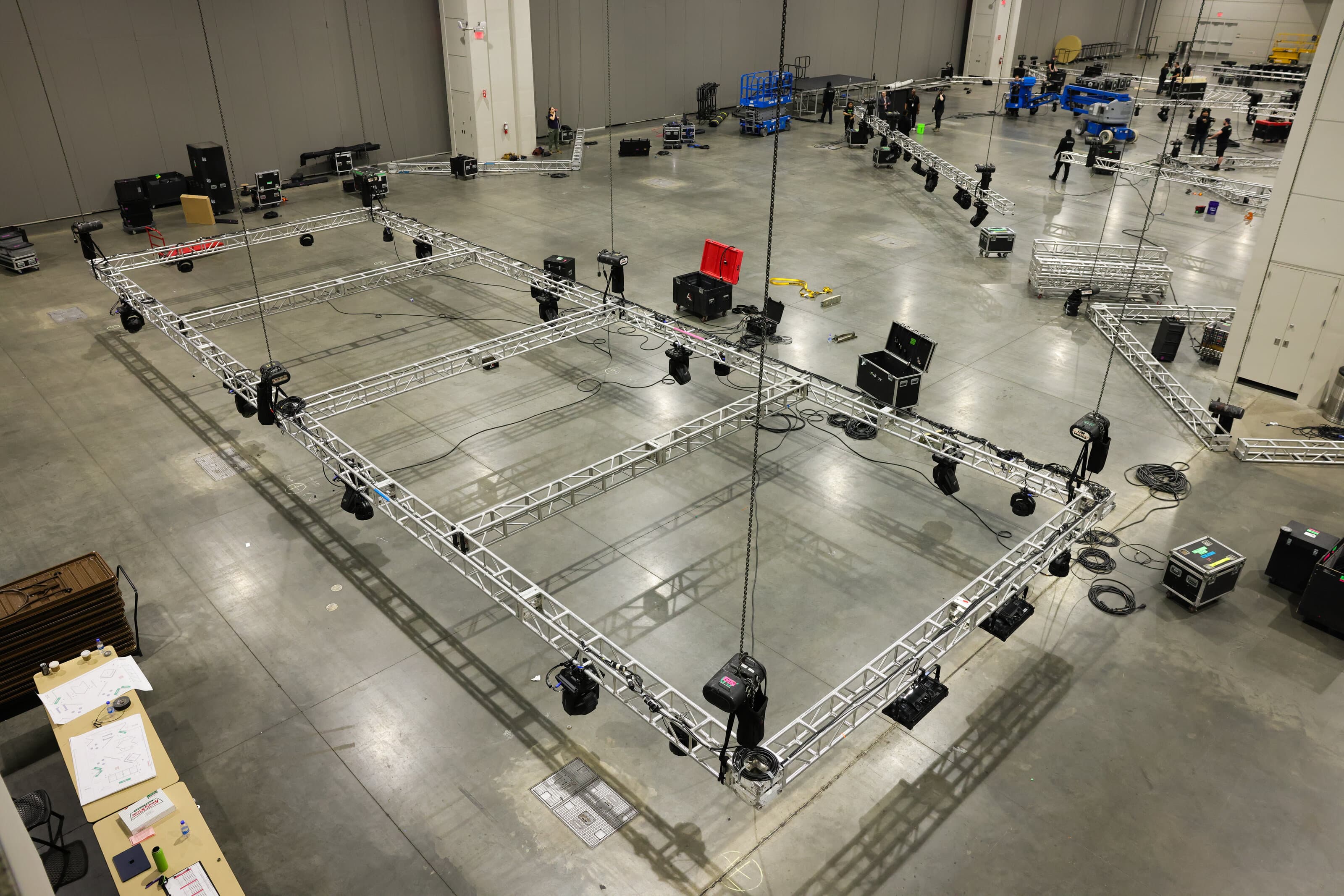 Truss and lighting suspended above a corporate event floor